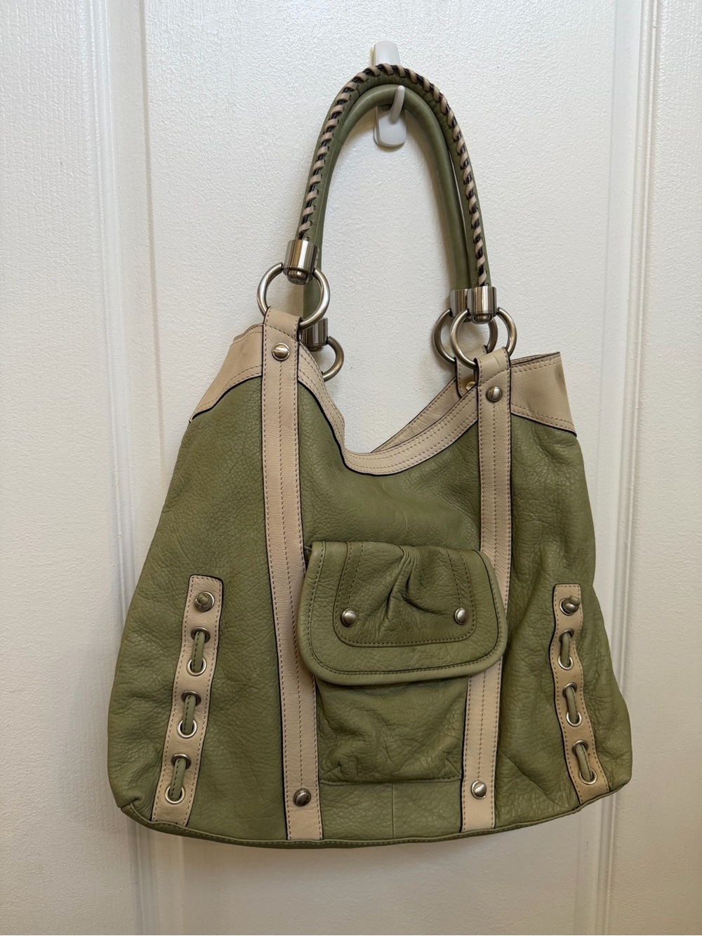 B. Makowsky green and cream shoulder bag